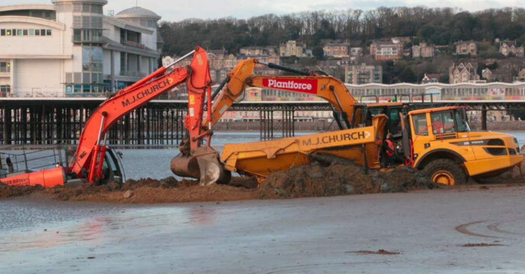 Two excavators attempting to remove tipper dumper 