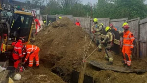 The trench where firefighters extracted worker