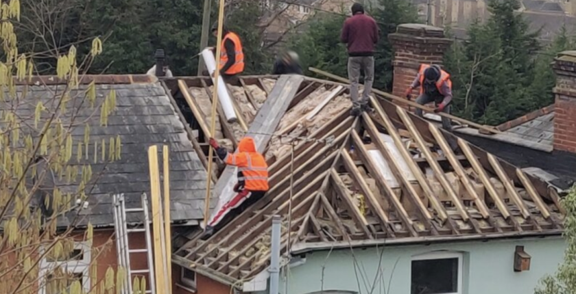 Roofers working with no scaffolding